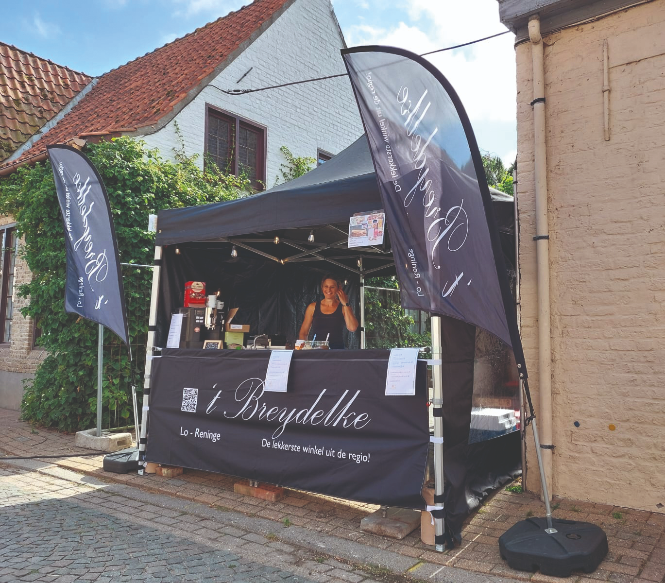 't Breydelke bedruke vouwtent en beachvlaggen